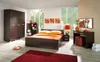 A bedroom with a bed, wardrobe, and dressing table. Anteprima dell’immagine prodotto