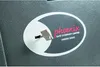 A close-up of a key inserted into a safe's lock mechanism, with branding visible. Anteprima dell’immagine prodotto
