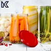 A collection of jars filled with preserved vegetables and a red lid. Podgląd zdjęcia produktu
