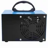 A blue and black ozone generator with a handle and a fan grill on the side. Voir les images du produit