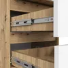 Close-up view of the interior of a wooden cabinet with three drawers and metal drawer slides. Produktbild-Vorschau