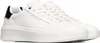 A pair of white Skechers sneakers with a black heel accent, shown from a side-angle on a white background. Anteprima dell’immagine prodotto