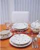 A table setting with Villeroy & Boch Petite Fleur dinnerware, wine glasses, and cutlery, decorated with pink flowers. Náhled obrázku produktu