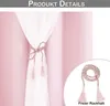 A close-up of a pink curtain tie-back with tassels, showing the product detail. Produktbild-Vorschau