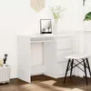 A white desk with drawers and a chair in a room with a window and curtains. Voir les images du produit