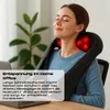 A woman is using a Shiatsu neck and shoulder massager while sitting at a desk with a laptop. Produktbild-Vorschau