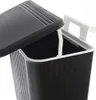 A close-up view of the top of a black trash can with a black lid partially open, revealing a white handle inside. Anteprima dell’immagine prodotto