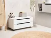 A bathroom setting with a white cabinet on wheels, a round rug, and a towel rack. Náhled obrázku produktu