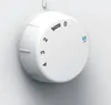 A close-up of a white rotary dial with numbers and markings. Produktbild-Vorschau
