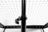 A close-up view of a black metal pole with a clamp attached, set against a white net background. Podgląd zdjęcia produktu