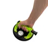 A hand holding a green vacuum lifter with a pressure gauge. Produktbild-Vorschau