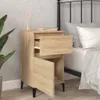 A bedside table next to a bed. Náhled obrázku produktu