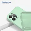 A close-up view of a light green phone case, showing the camera cutout and the interior lining. Produktbild-Vorschau