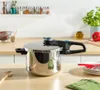 A pressure cooker is shown on a kitchen counter. Produktbild-Vorschau