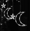 Close-up of decorative crescent moon and star-shaped lights with LED bulbs, hanging in the dark. Náhľad obrázku produktu
