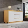A modern sideboard with white drawers and a wooden frame, placed in a room with a gray wall and a large window. Produktbild-Vorschau