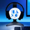 A black headset is displayed on a black stand with a white spherical light featuring the PlayStation logo. Anteprima dell’immagine prodotto