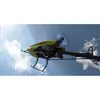 A remote-controlled helicopter flying in the sky. Produktbild-Vorschau
