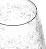A close-up view of a clear glass with a delicate floral pattern etched onto its surface. Anteprima dell’immagine prodotto