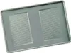 A gray plastic lid with two rectangular recessed areas, each containing parallel lines. Produktbild-Vorschau