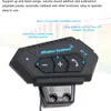 Close-up view of a black wireless earphone headset with buttons and labels indicating its functions. Produktbild-Vorschau
