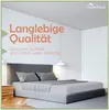 A bedroom scene with a bed, headboard, and bedside table. Produktbild-Vorschau