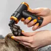 A person is using a dog nail grinder on a dog's paw. Náhled obrázku produktu