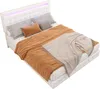 A white bed with bedding and pillows, illuminated by LED lights. Produktbild-Vorschau