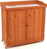 A wooden garden cabinet with double doors and wheels, shown against a white background. Náhled obrázku produktu