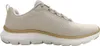 A side view of a beige Skechers sneaker against a white background. Voir les images du produit