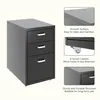 A black three-drawer filing cabinet with silver handles, shown from a slightly angled front-left perspective. Detail shots highlight its smooth surface, swivel casters, and sturdy structure. Anteprima dell’immagine prodotto