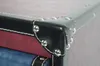 A close-up view of the corner of a trunk-style storage unit, highlighting the decorative metal studs and stitching. Podgląd zdjęcia produktu