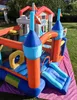 An inflatable castle bounce house set up on a grassy lawn with a pink and purple mat underneath. Náhled obrázku produktu