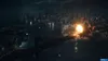 An aerial view of a city at night with a large explosion on a bridge. Produktbild-Vorschau