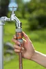 A hand connecting a garden hose to a faucet. Náhled obrázku produktu