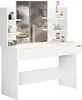 A white vanity table with a tri-fold mirror and shelves, decorated with various cosmetic items and a vase with flowers. Náhľad obrázku produktu