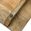 A close-up view of the underside of a wooden serving board, showing a dark circular foot. Anteprima dell’immagine prodotto