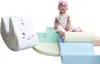 A baby sitting on a pastel-colored soft play set with a unicorn design. Produktbild-Vorschau
