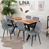 A dining room set with a wooden table and six gray chairs, decorated with plants and artwork. Produktbild-Vorschau