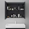 A bathroom cabinet with its doors open, displaying various toiletries and bathroom accessories. Produktbild-Vorschau