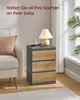 A bedside table with three drawers next to a sofa, with a lamp and phone on top. Produktbild-Vorschau