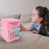 A young girl looking at a pink piggy bank. Náhľad obrázku produktu