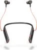 A pair of black and gray wireless earbuds with orange accents, connected by a neckband, displayed against a white background. Voir les images du produit