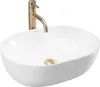 A white oval countertop sink with a gold faucet and drain. Anteprima dell’immagine prodotto