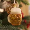 A glass beer mug Christmas ornament hangs on a Christmas tree. Produktbild-Vorschau