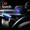 A close-up view of a UV torch shining a blue light on car engine components. Anteprima dell’immagine prodotto