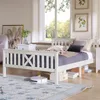 A bedroom scene with a white wooden bed, pillows, and a blanket. Produktbild-Vorschau
