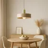 A modern dining room setting with a pendant light, dining table, chairs, and a sideboard. Produktbild-Vorschau