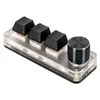 A close-up studio shot of a custom macro keyboard with three black keycaps and one silver rotary encoder, set against a white background. Náhled obrázku produktu