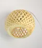 A close-up shot of a woven bamboo pendant light. Produktbild-Vorschau